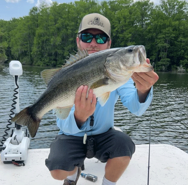 Fresh Water Angler with Bass Fish Fresh Water Angler with Bass Fish on Topsail Island Fishing