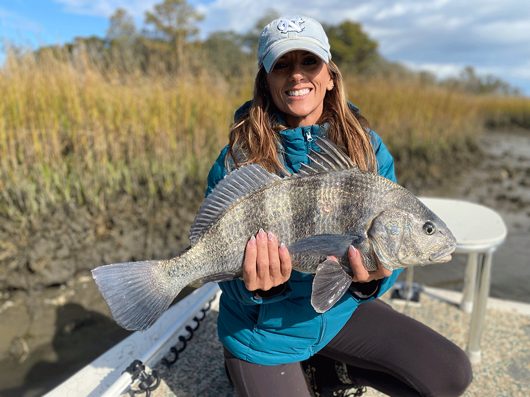 Lady Angler with large fish Lady Angler with large fish on Topsail Island Fishing