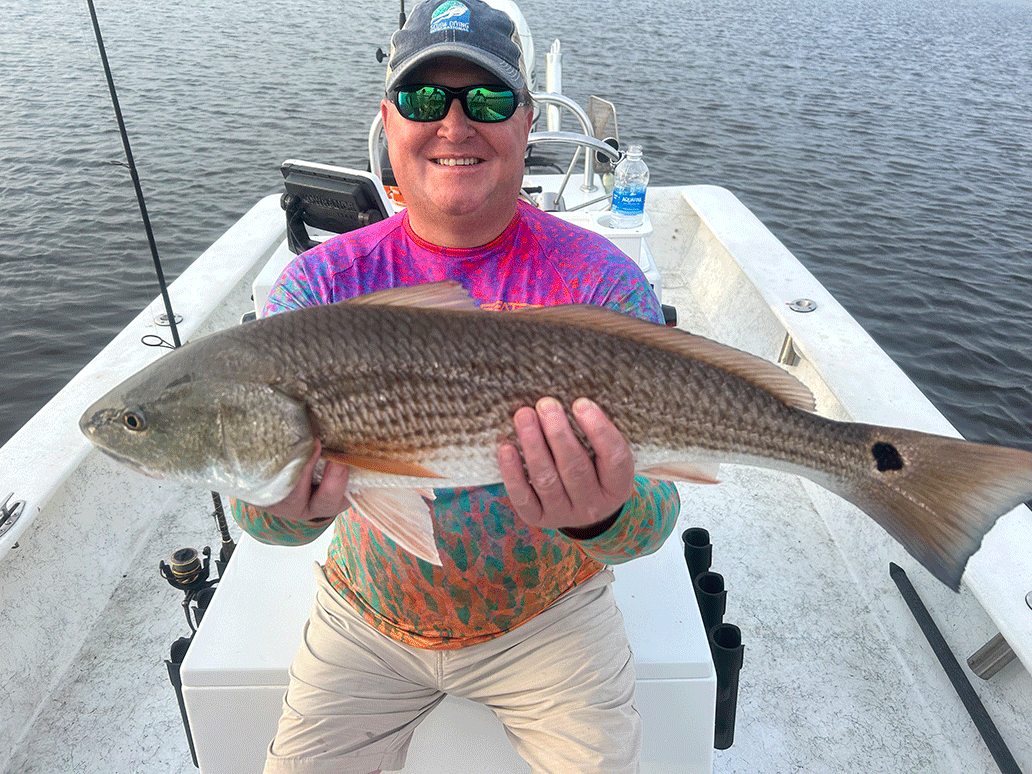 Military Veteran with Red Drum Fish